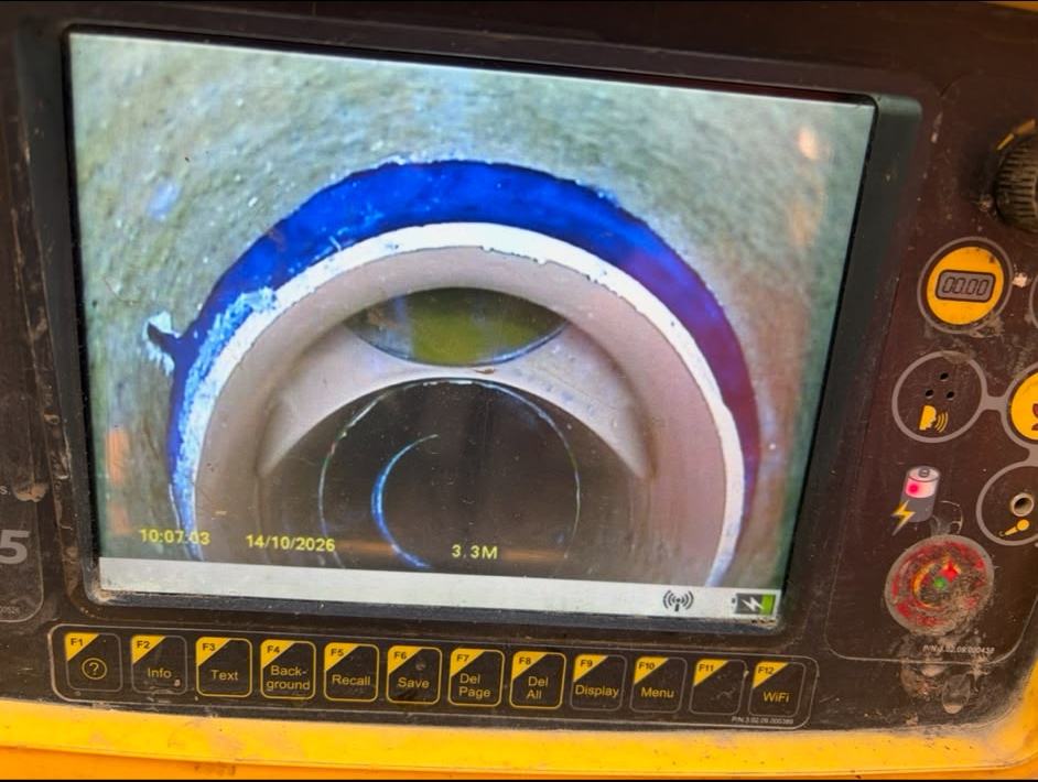 Drain camera monitor showing the inside of a clay pipe joint